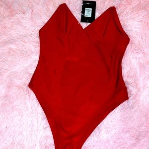 Red clear straps bodysuit, compressed, swim suit like material.